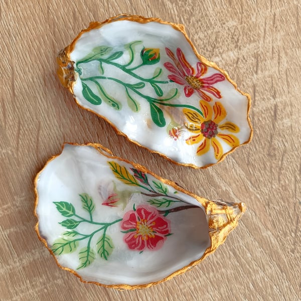 Two floral hand-finished oyster shells