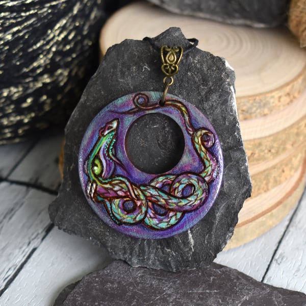 The fairy light dragon. Hand burned and coloured Pyrography pendant.