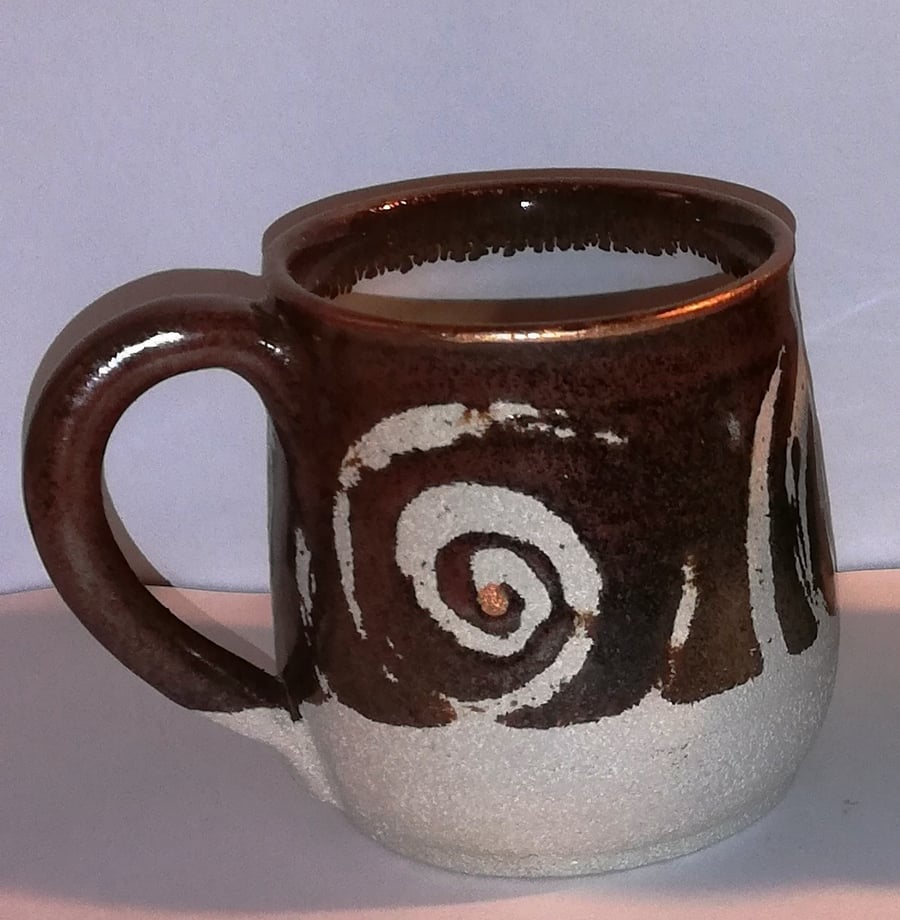 Earthy, spiral decorated mugs