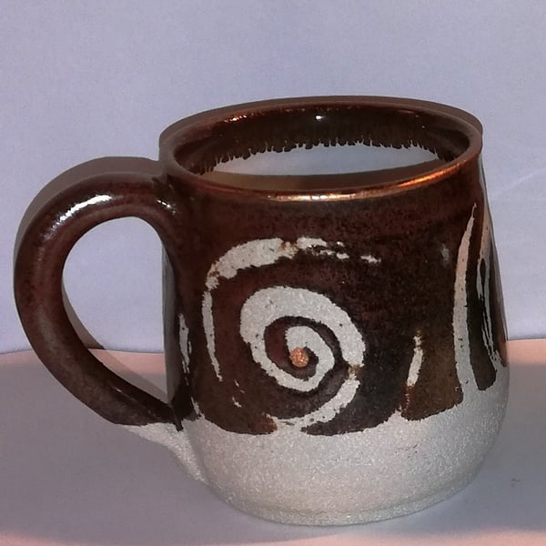 Earthy, spiral decorated mugs