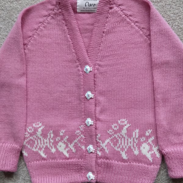 Child's cardigan with fish round the bottom and hand painted fish buttons