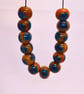 Handmade teal and mustard daisy patterned lamp work glass beads - Image 8