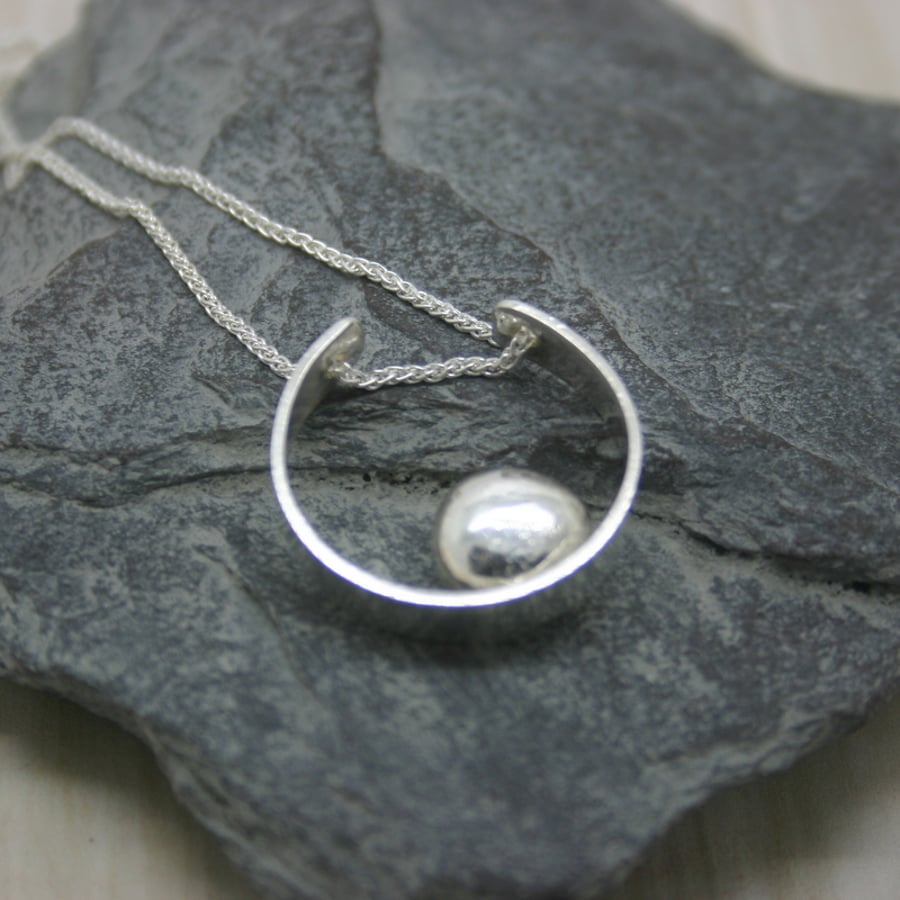 Sterling Silver open circle with 1 sterling silver pebble