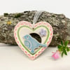 Small Ceramic bird in a pink heart decoration 