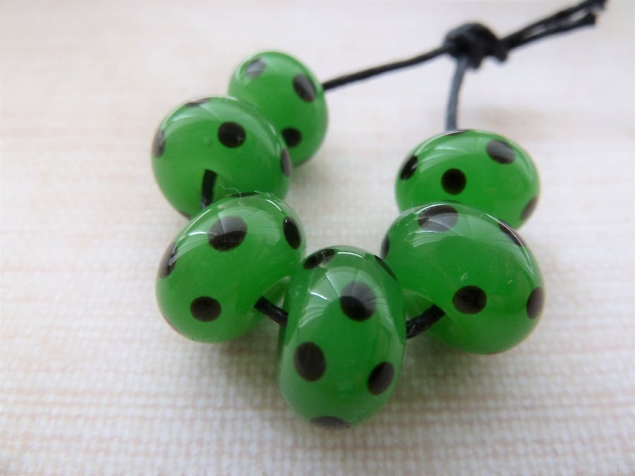 green and black spots lampwork glass beads