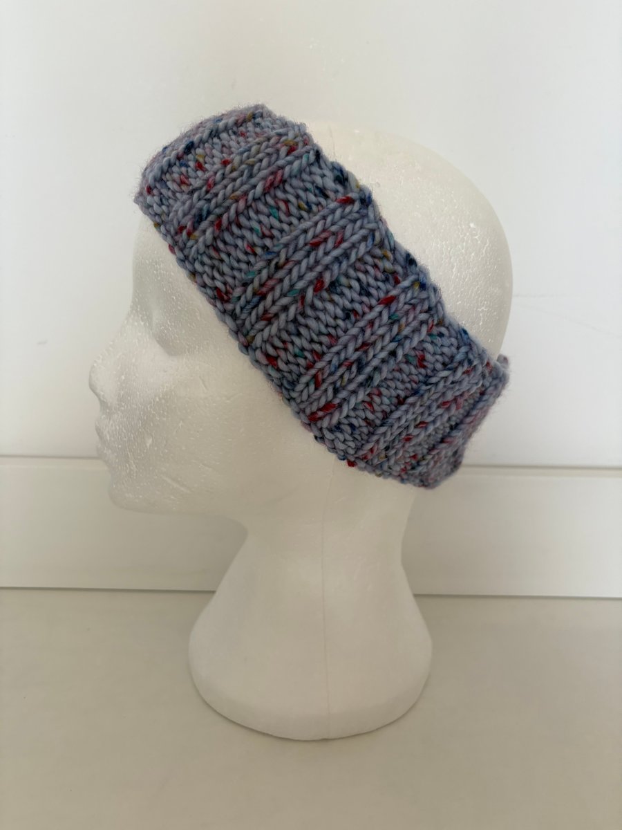 Blue fleck knitted headband. 