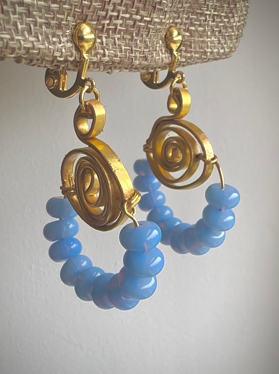 Gold earrings with jade beads in blue