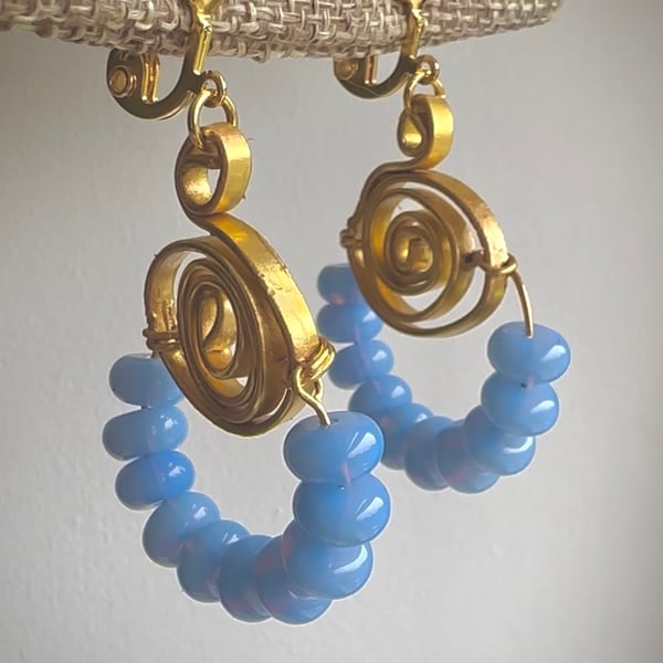 Gold earrings with jade beads in blue