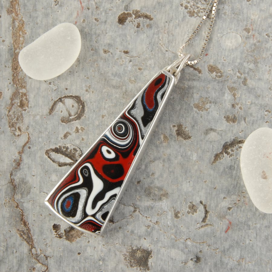 Sterling silver and 80's fordite pendant