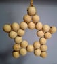 Large rustic star made with wooden beads and jute string