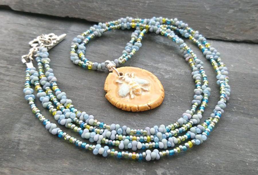 SALE ceramic bee pendant and seed bead necklace, mustard and blue