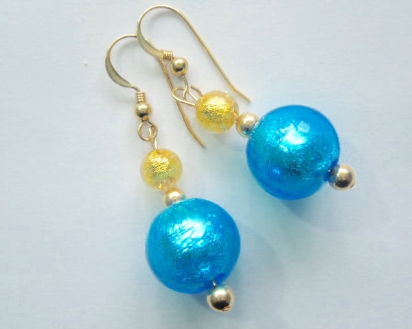 Turquoise Murano glass earrings with gold filled ear hooks.