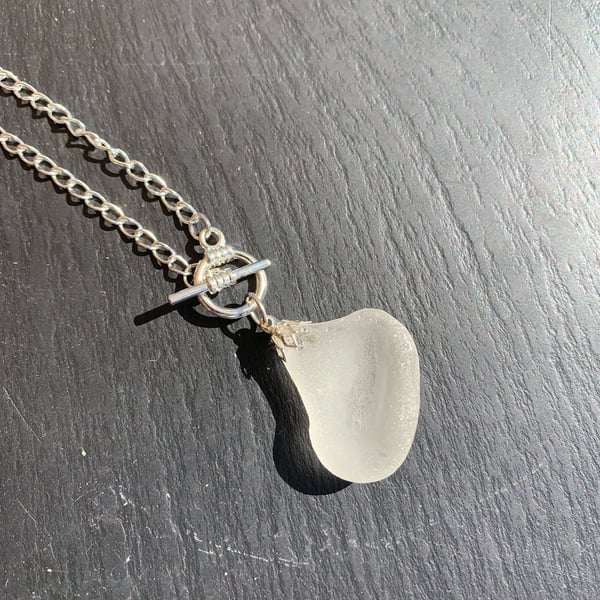 White seaglass drop on silver plate mount & 22in SP toggle fastening chain