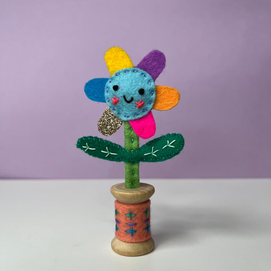 Embroidered Happy Flower in Wooden Bobbin - Blue Face with Coral Bobbin