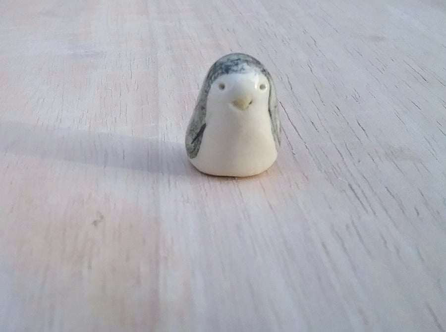 Hand made ceramic penguin very little and in need of a home for pottery penguins