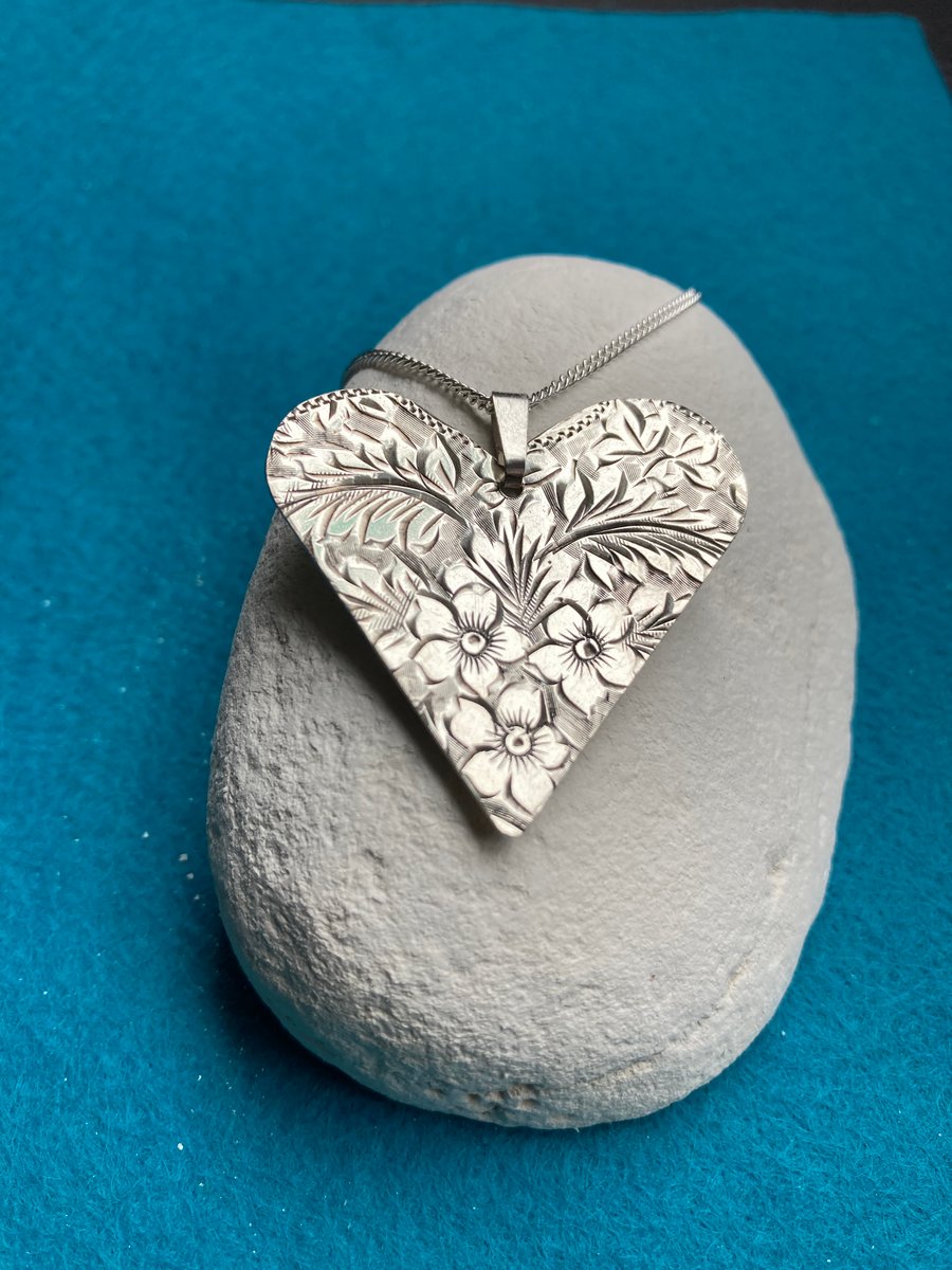 Silver heart shaped floral necklace made from a 1915 cigarette case