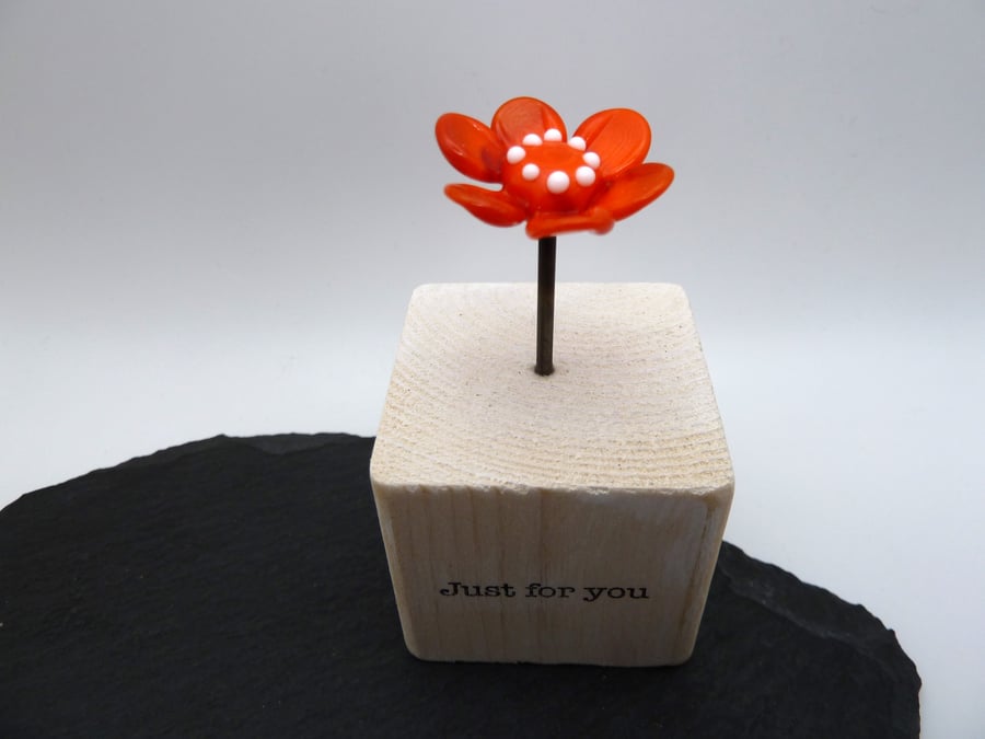 wood block, orange flower