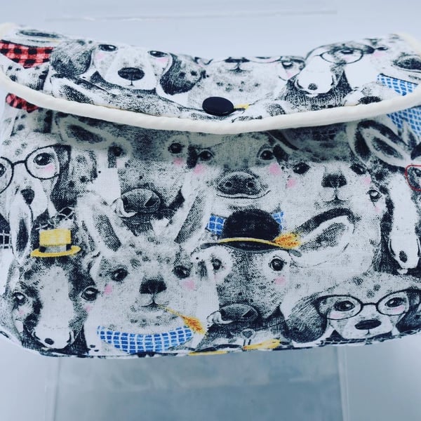 Cosmetic or make up bag. Pet lover gift featuring a fun print of animals.