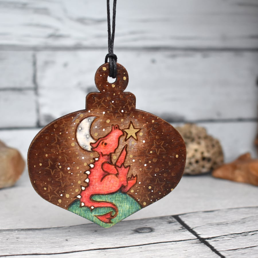 Red dragon and a star hanging bauble. Pyrography personalisable Yule decoration.