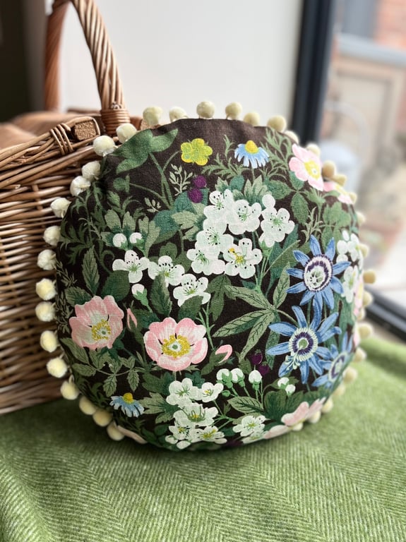 Round feature cushion in vintage Belinda linen with pompoms