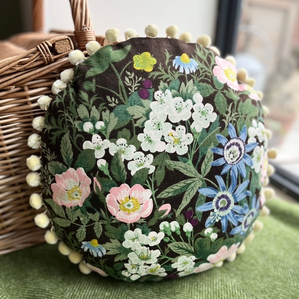 Round feature cushion in vintage Belinda linen with pompoms