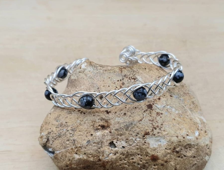 Adjustable Snowflake Obsidian cuff bracelet. Wire wrapped Celtic Weave
