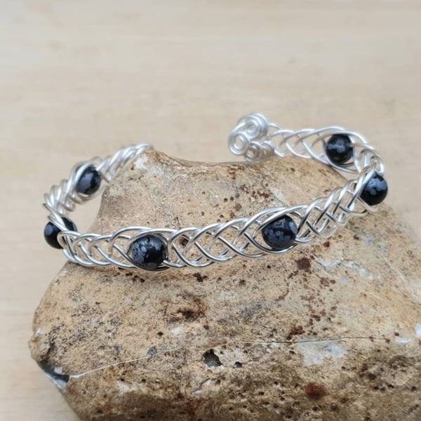 Adjustable Snowflake Obsidian cuff bracelet. Wire wrapped Celtic Weave