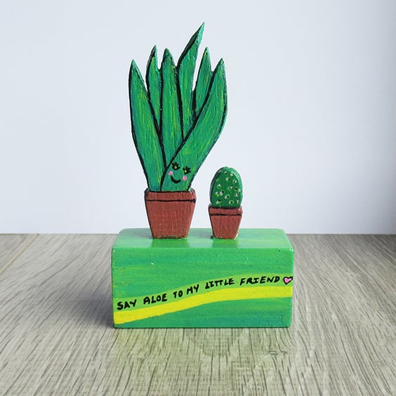 Wooden ornament, aloe plant, cactus