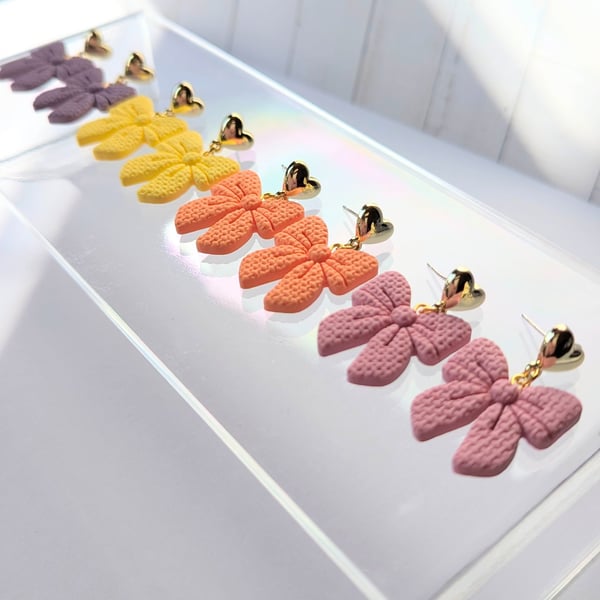 Ribbon bow drop earrings.