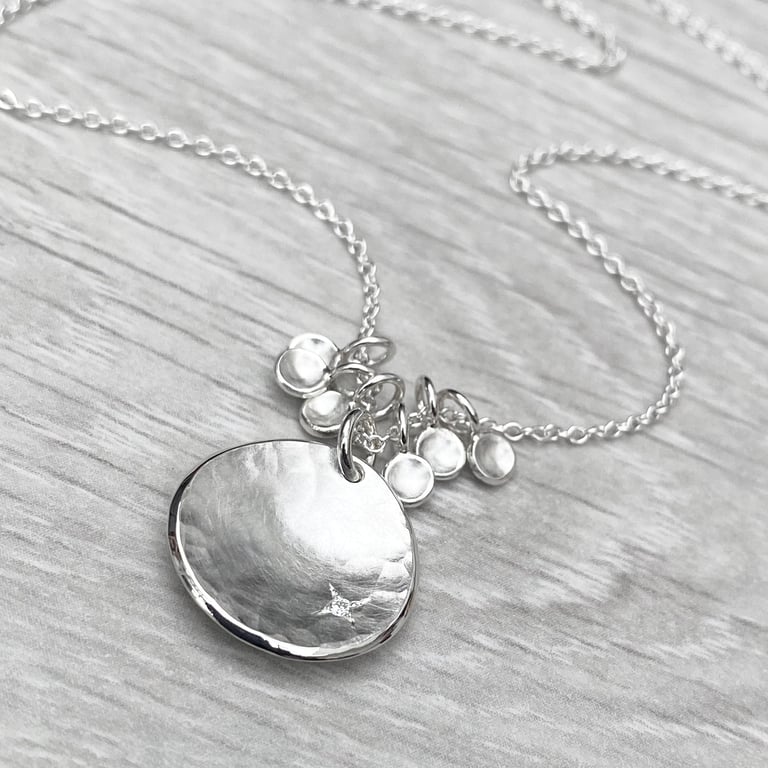 Handmade sterling silver 16mm diamond kiss petal charm pendants on a trace chain