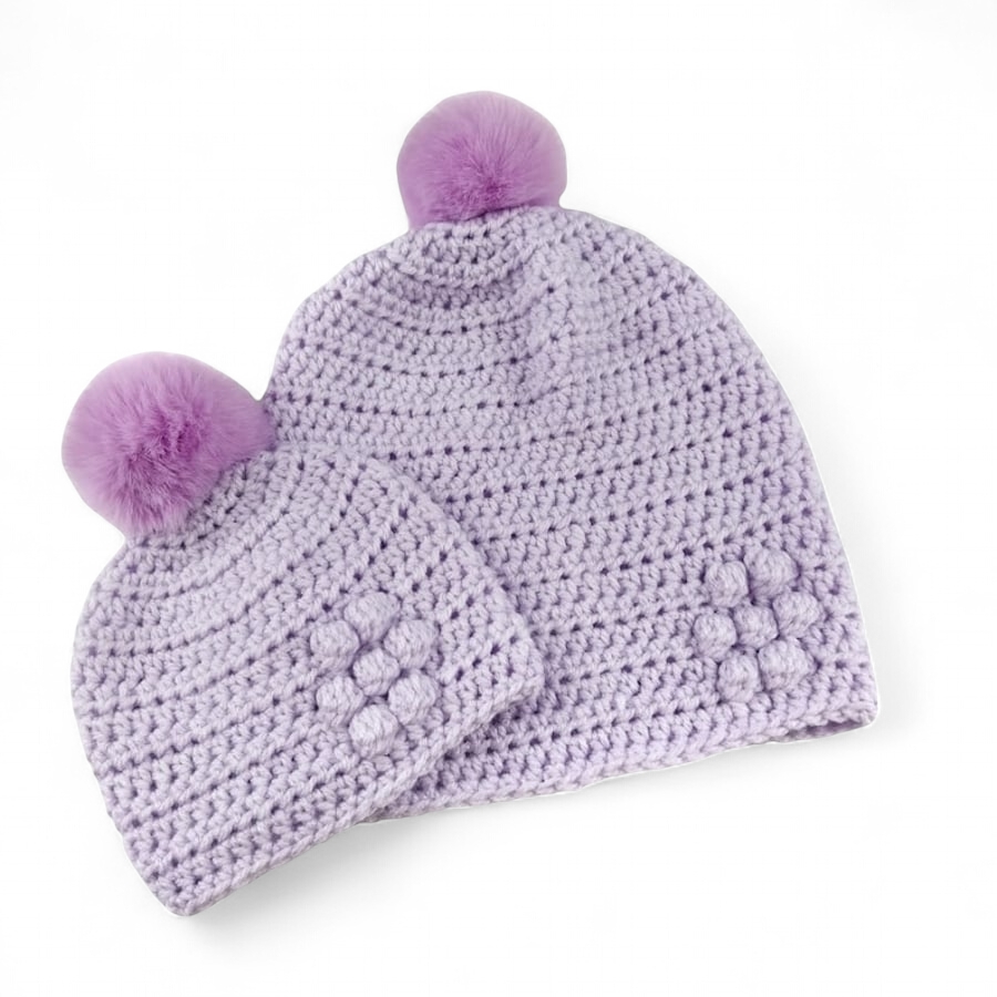Matching ladies and baby lilac crocheted hats with detachable faux fur pompoms 