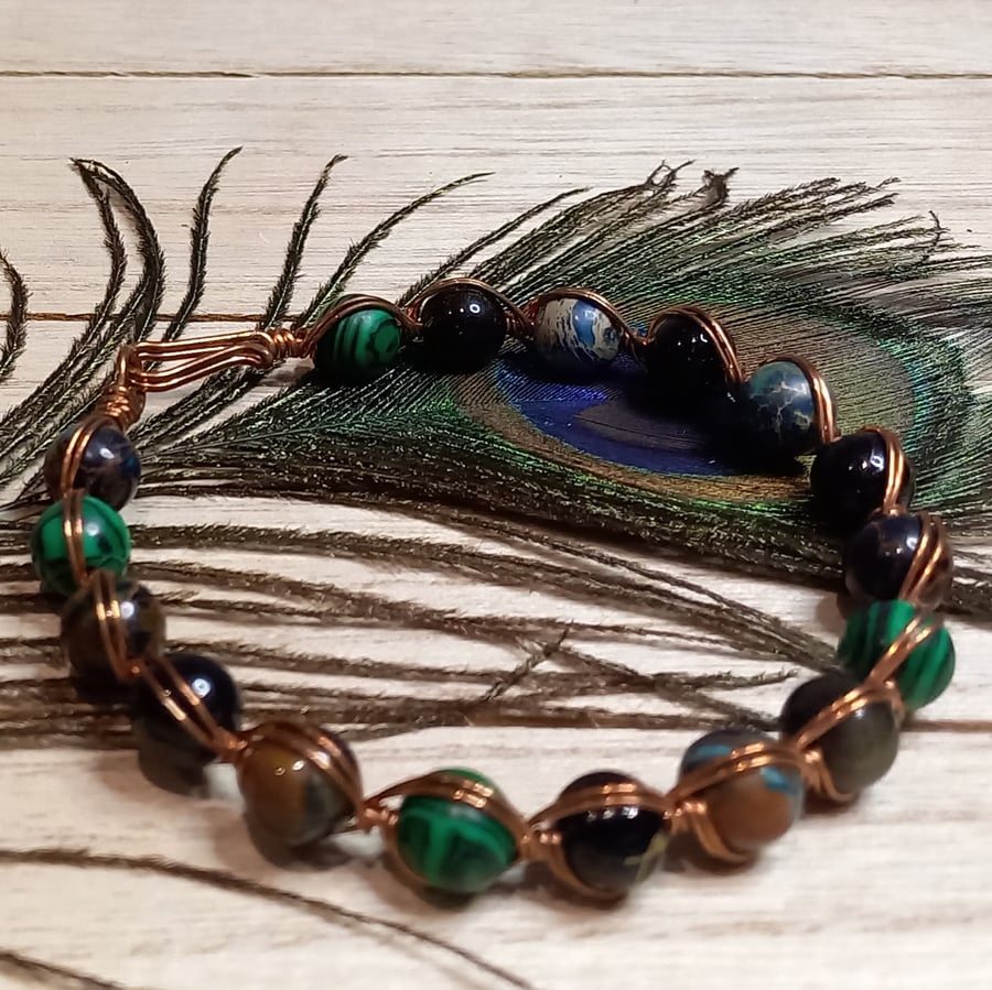 Twisted copper wire bracelet with green jasper and tiger's eye beads