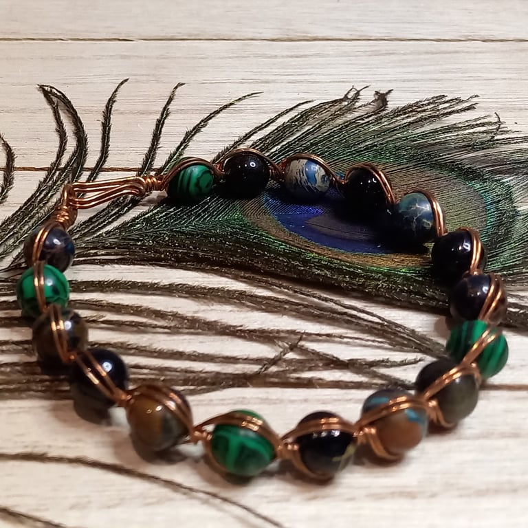 Twisted copper wire bracelet with green jasper and tiger's eye beads