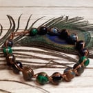 Twisted copper wire bracelet with green jasper and tiger's eye beads