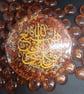 Beautiful round resin piece witrh gold arabic calligraphy ,golden flakes inside  - Image 2