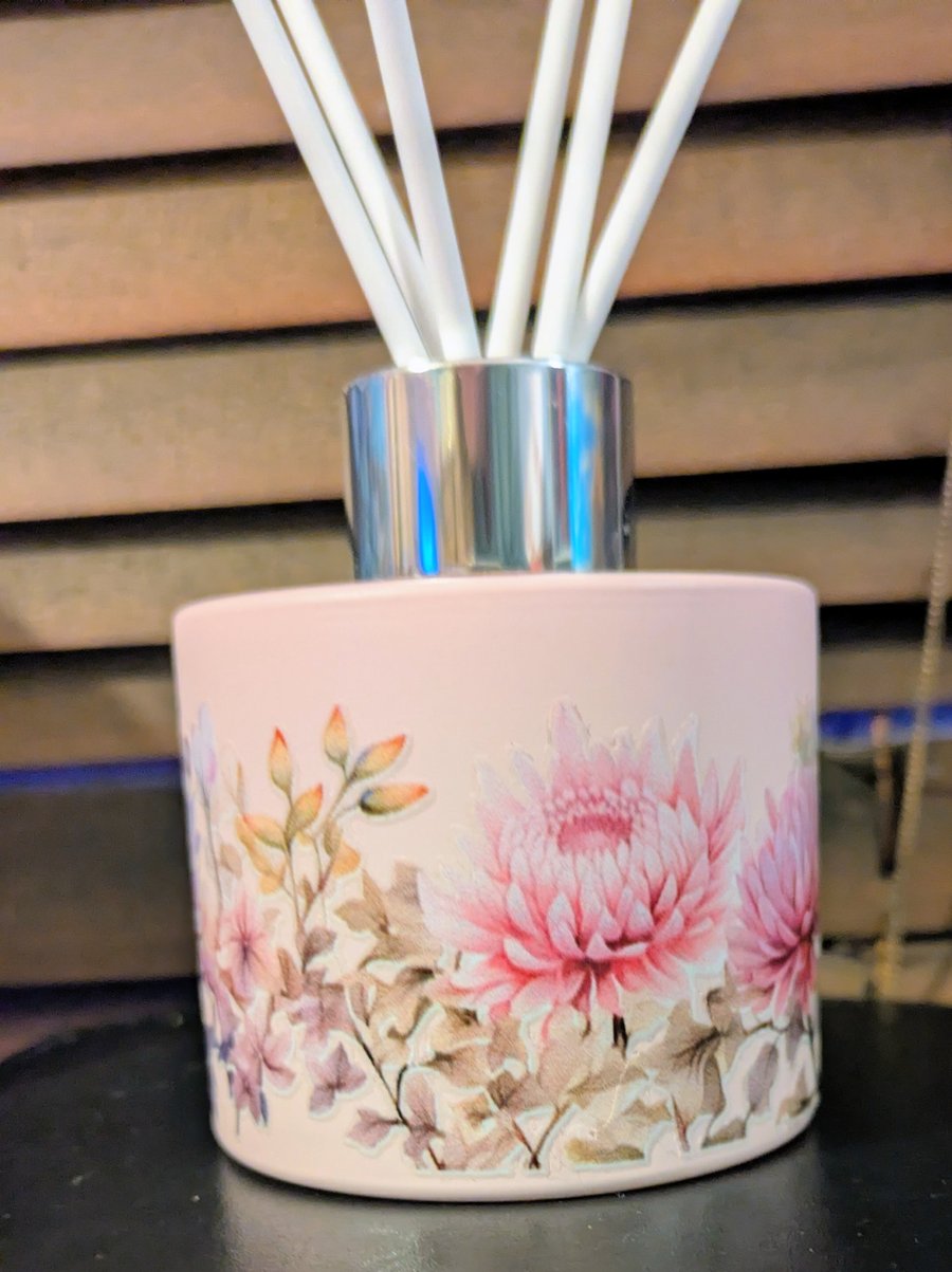 Pink glass floral diffuser bottle with white reed sticks 