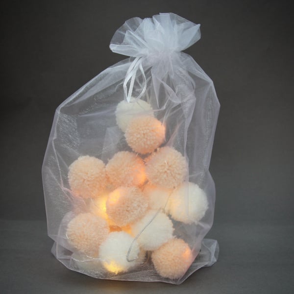 20 pom-pom fairy lights in peaches & cream.