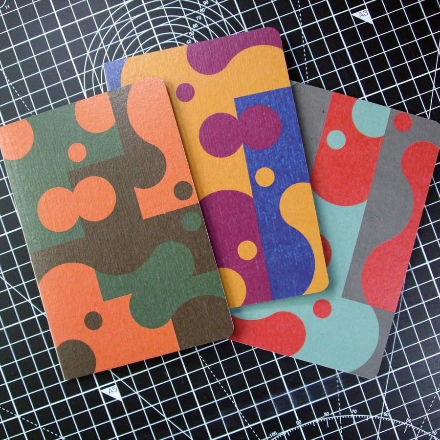 ARC05 Pack of three A6 pocket notebooks with graphic pattern covers