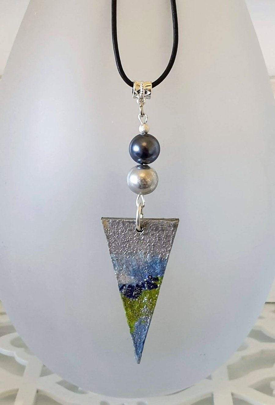 Geometric wood pendant on leather cord