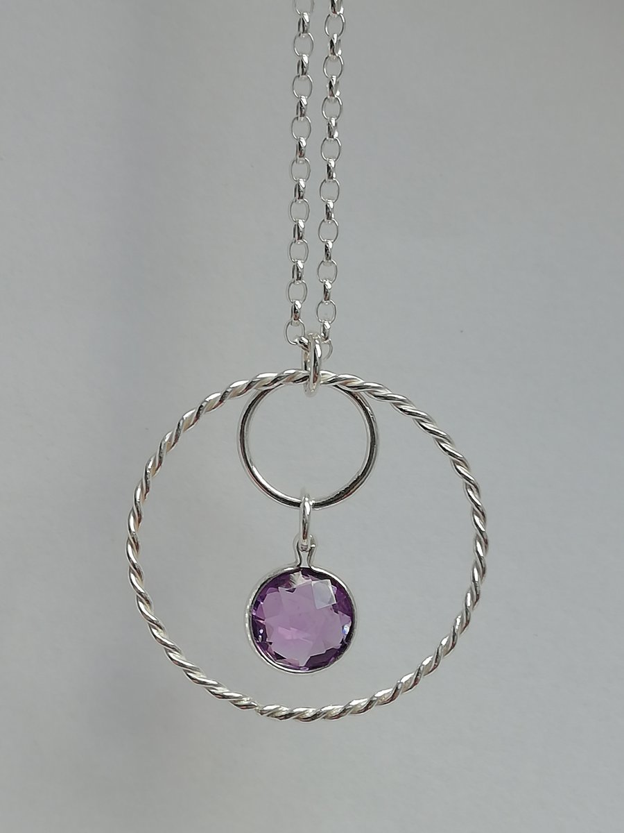 Silver Necklace of Double Rings with a Faceted Coin Amethyst