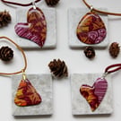 Dark red or purple and yellow floral patterned pendants