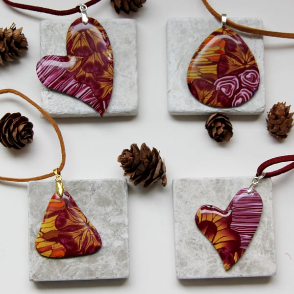 Dark red or purple and yellow floral patterned pendants