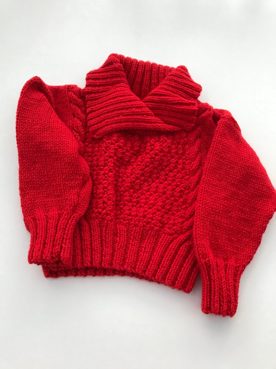 Hand knitted toddler jumper with a shawl collar