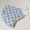 One medium size double layered adjustable reusable and washable face mask