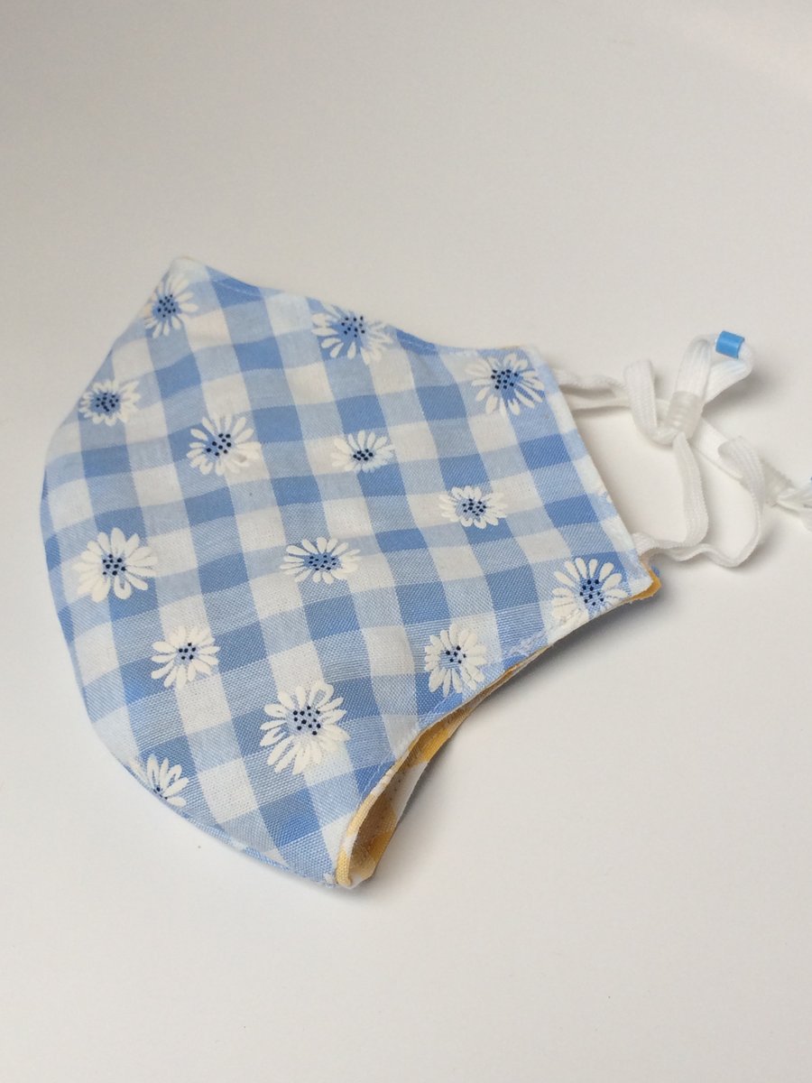 One medium size double layered adjustable reusable and washable face mask