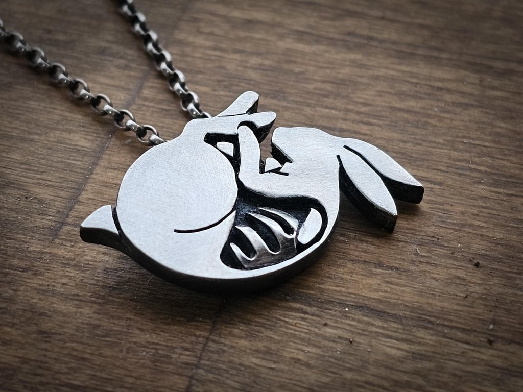 Sterling silver, hallmarked skeletal rabbit pendant. Oxidised and frosted finish