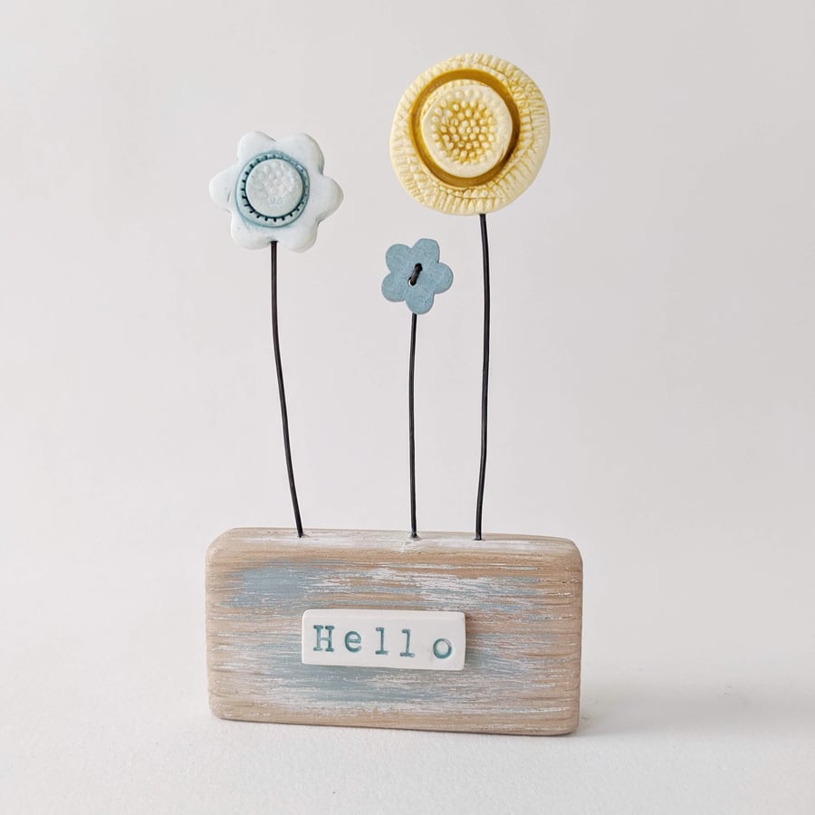 Clay and Button Flower Garden in a Wood Block 'Hello'