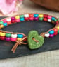 Multicoloured howlite bead and leather bracelet with green ceramic heart button - Image 2