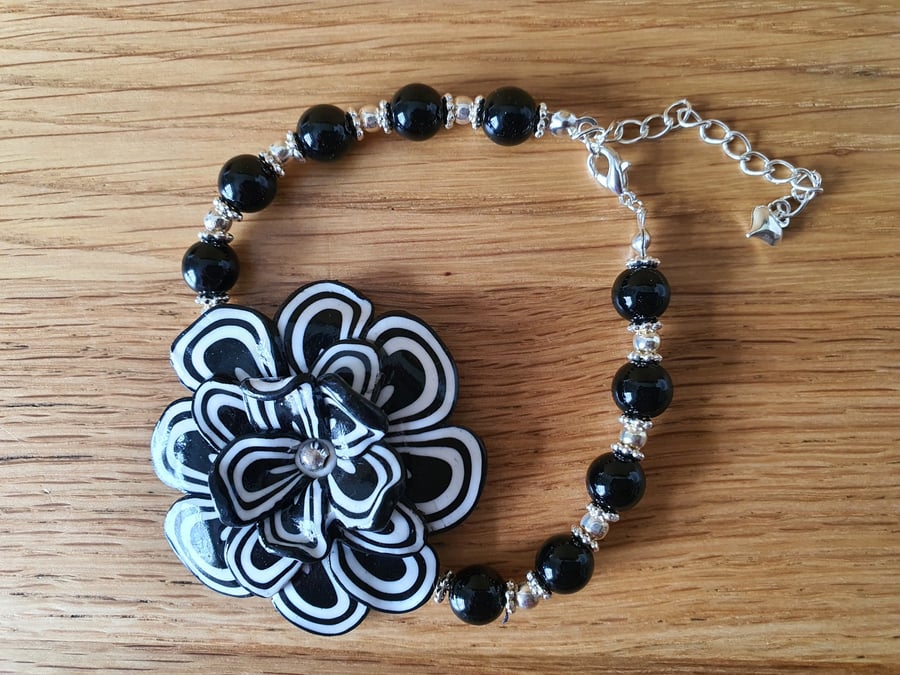 Unique Black and White Beaded Bracelet with a Floral Centre Piece