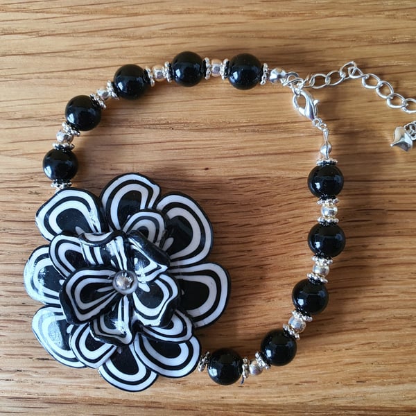 Unique Black and White Beaded Bracelet with a Floral Centre Piece